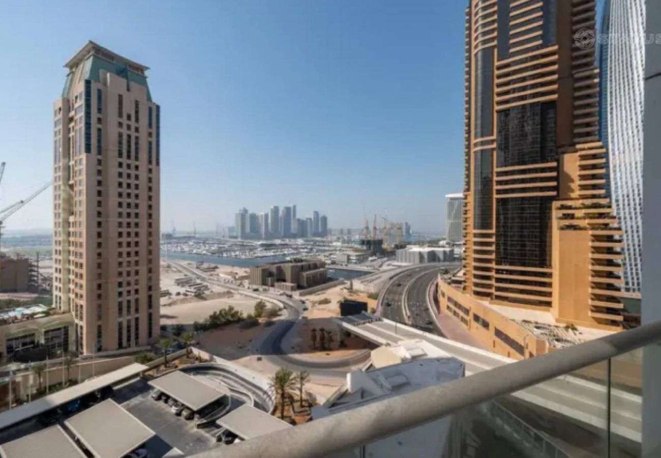 Apartment in Dubai - Stylish 1BR Apartment with Partial Sea View 
