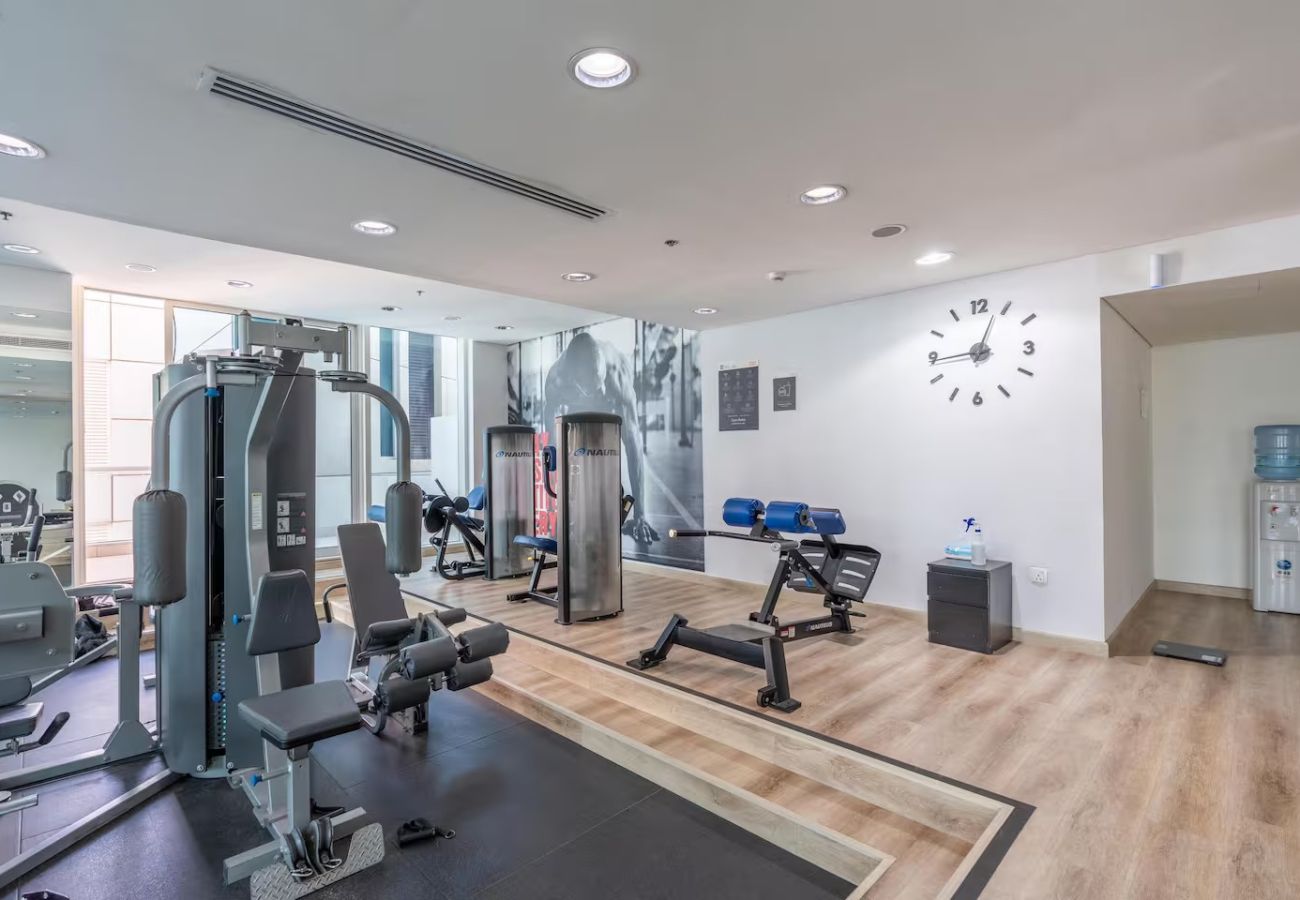 Apartment in Dubai - Stylish 1BR Apartment with Partial Sea View 