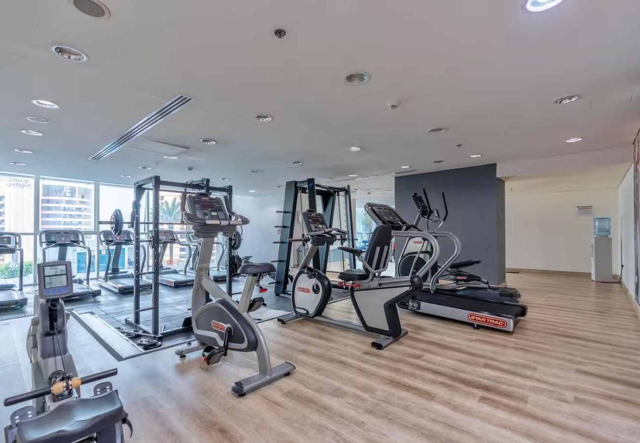 Apartment in Dubai - Stylish 1BR Apartment with Partial Sea View 