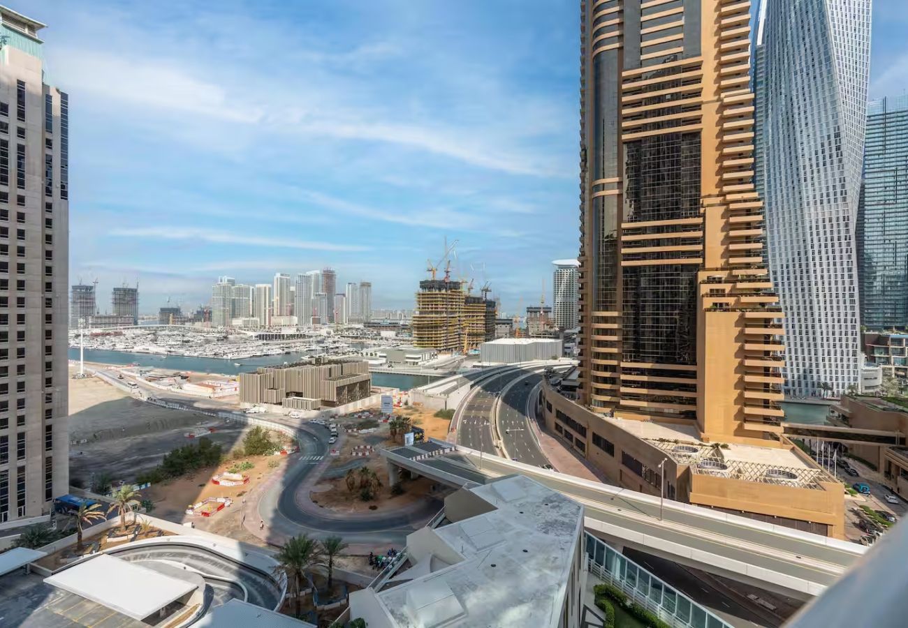 Apartment in Dubai - Stylish 1BR Apartment with Partial Sea View 