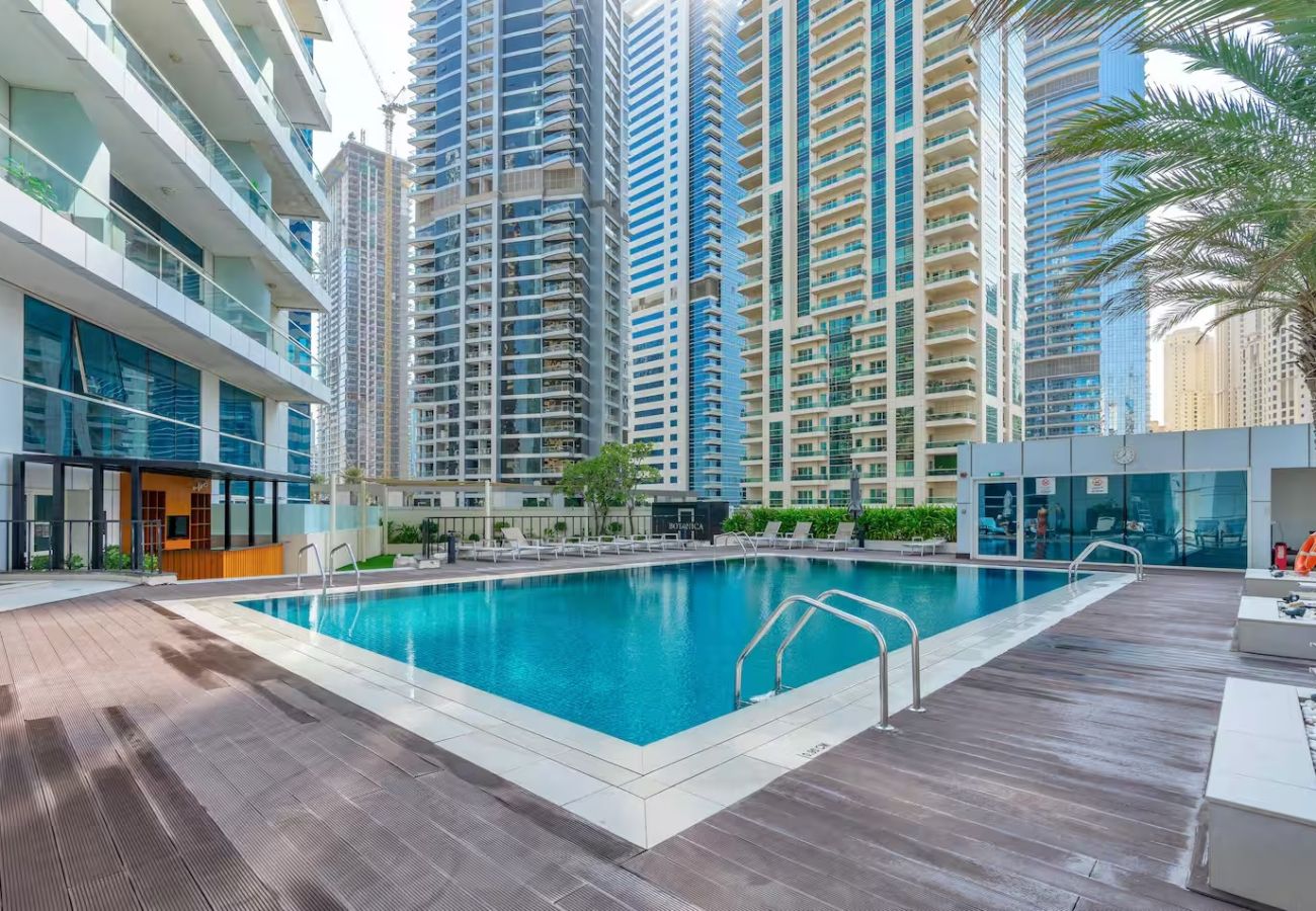 Apartment in Dubai - Stylish 1BR Apartment with Partial Sea View 