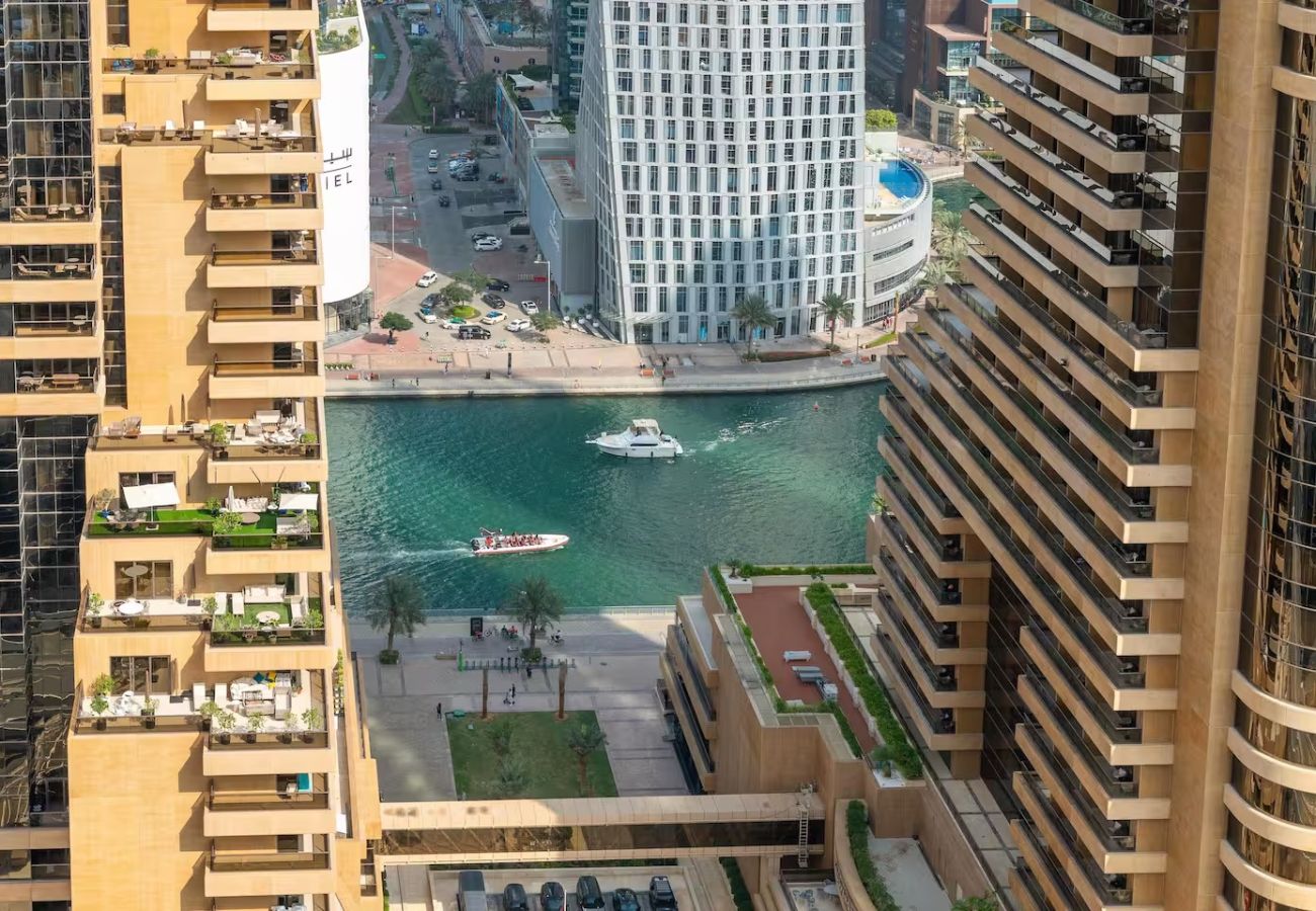 Apartment in Dubai - Stylish 1BR Apartment with Partial Sea View 